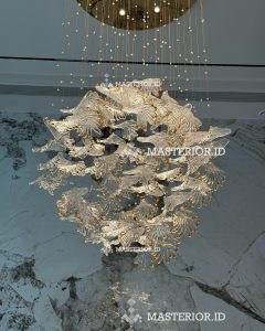 Organic sculptural glass chandelier inspired by flowing natural forms with warm LED illumination.