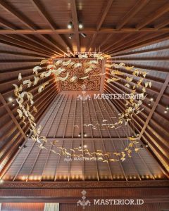 Custom spiral chandelier with suspended illuminated glass elements for a grand staircase.